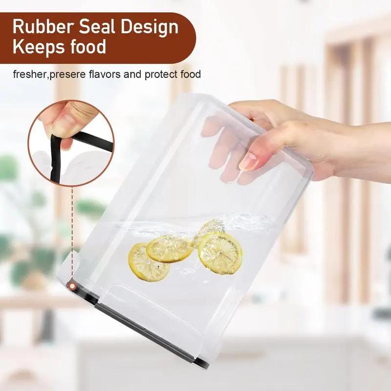 Hand holding a transparent food storage container with rubber seal design, showing preserved lemon slices.